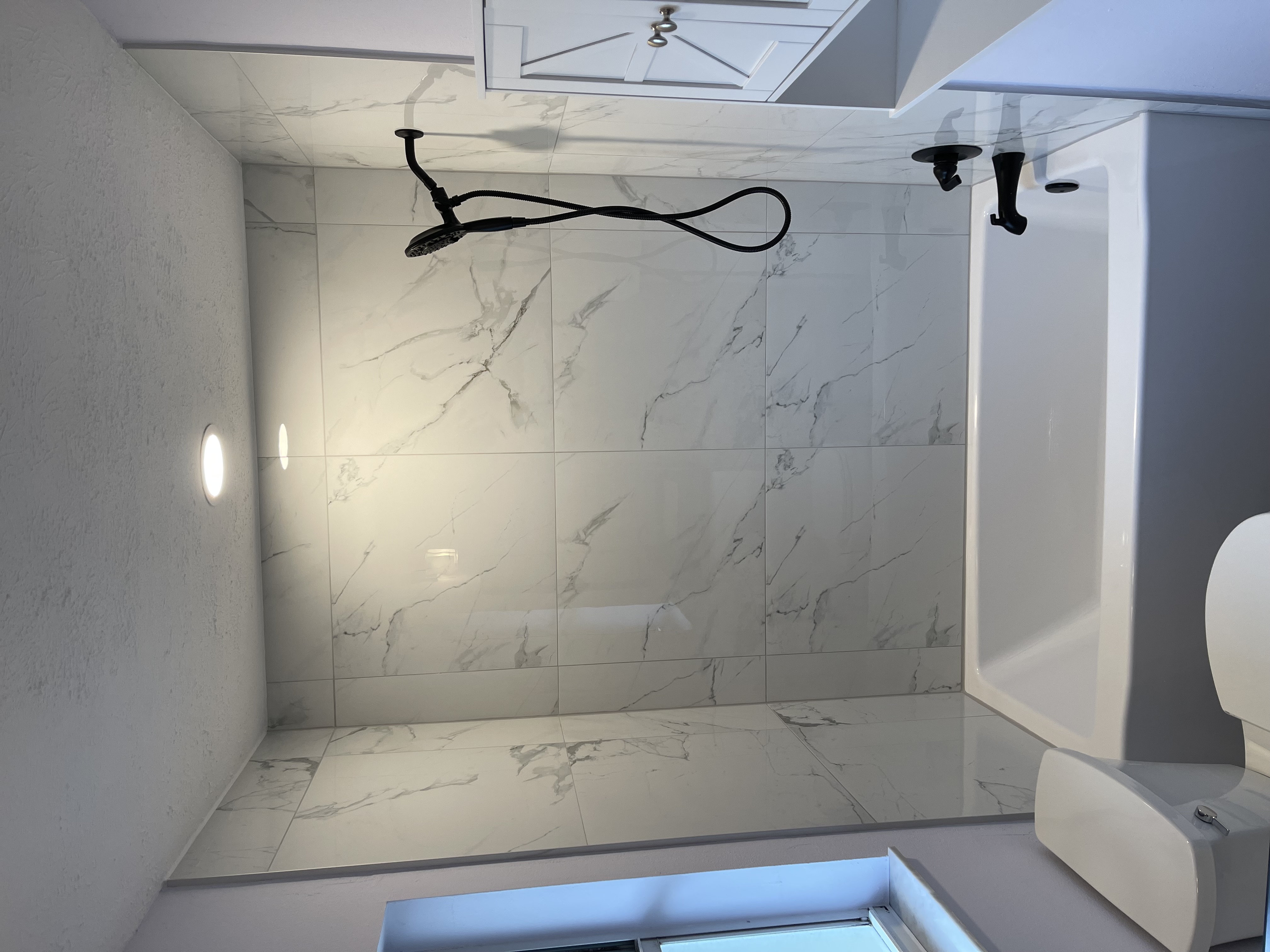 Bathroom remodel with updated tile and fixtures